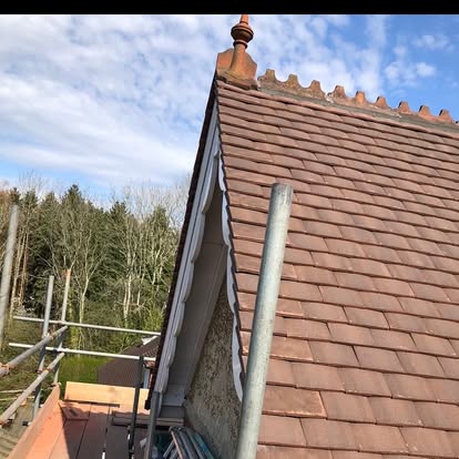 Clay tile re-roof with gable finial